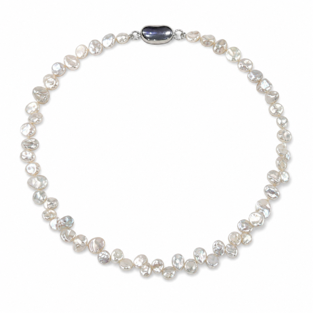 White freshwater pearl necklace with small oval dark blue centerpiece and silvertone clasp
