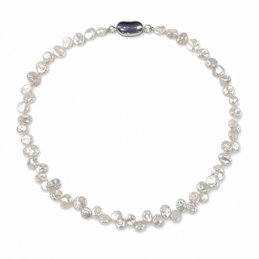 White freshwater pearl necklace with small oval dark blue centerpiece and silvertone clasp