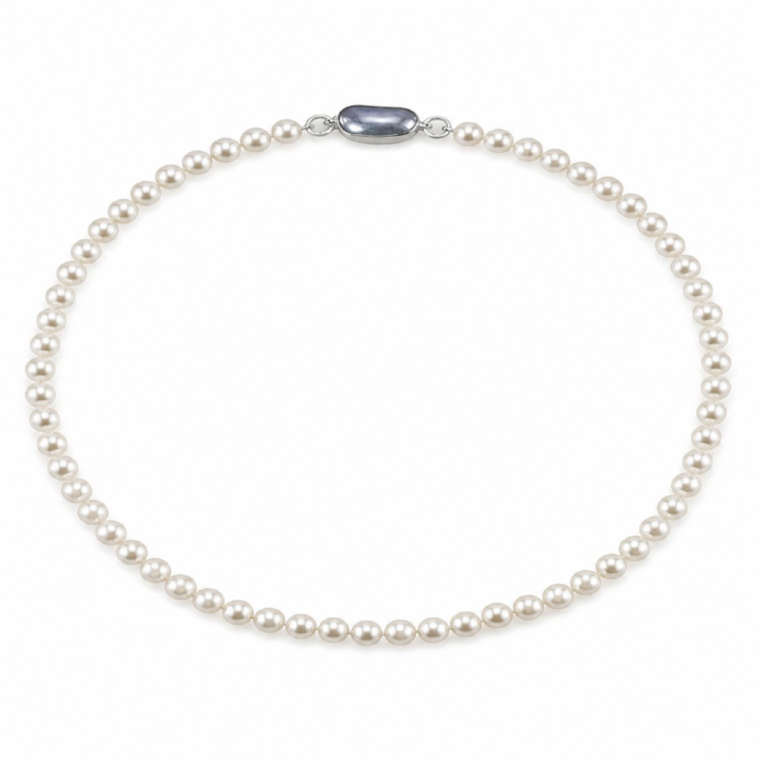 White pearl necklace with uniform round pearls and an oval silver clasp at the center