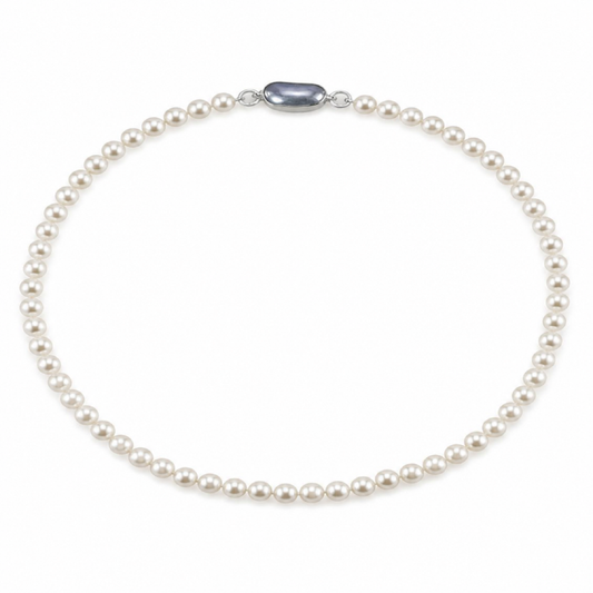 White pearl necklace with uniform round pearls and an oval silver clasp at the center