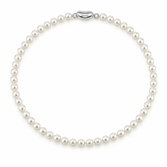 White pearl necklace with evenly spaced round pearls and oval metal clasp