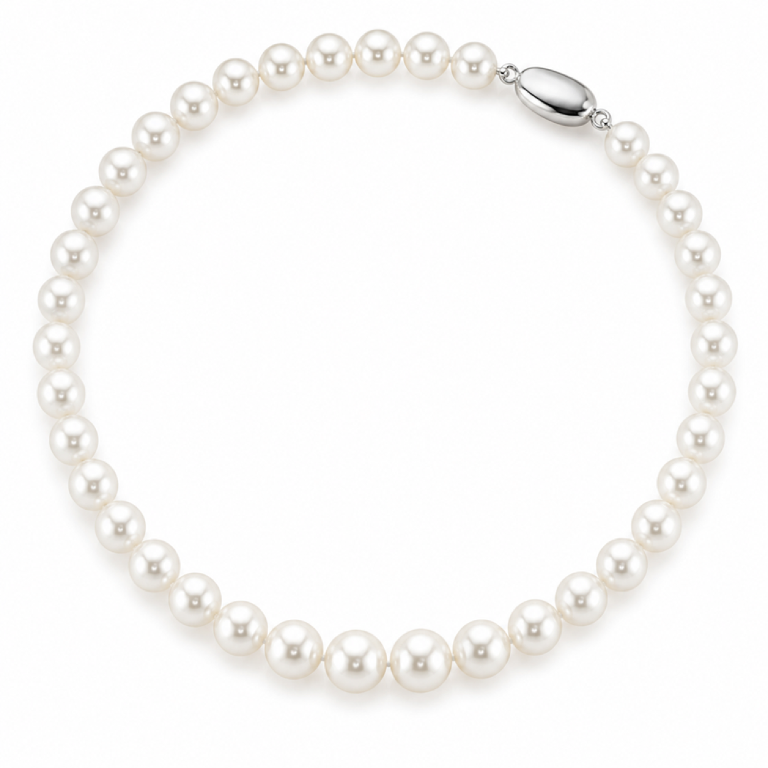 White freshwater pearl necklace with uniform round pearls and silver clasp on side
